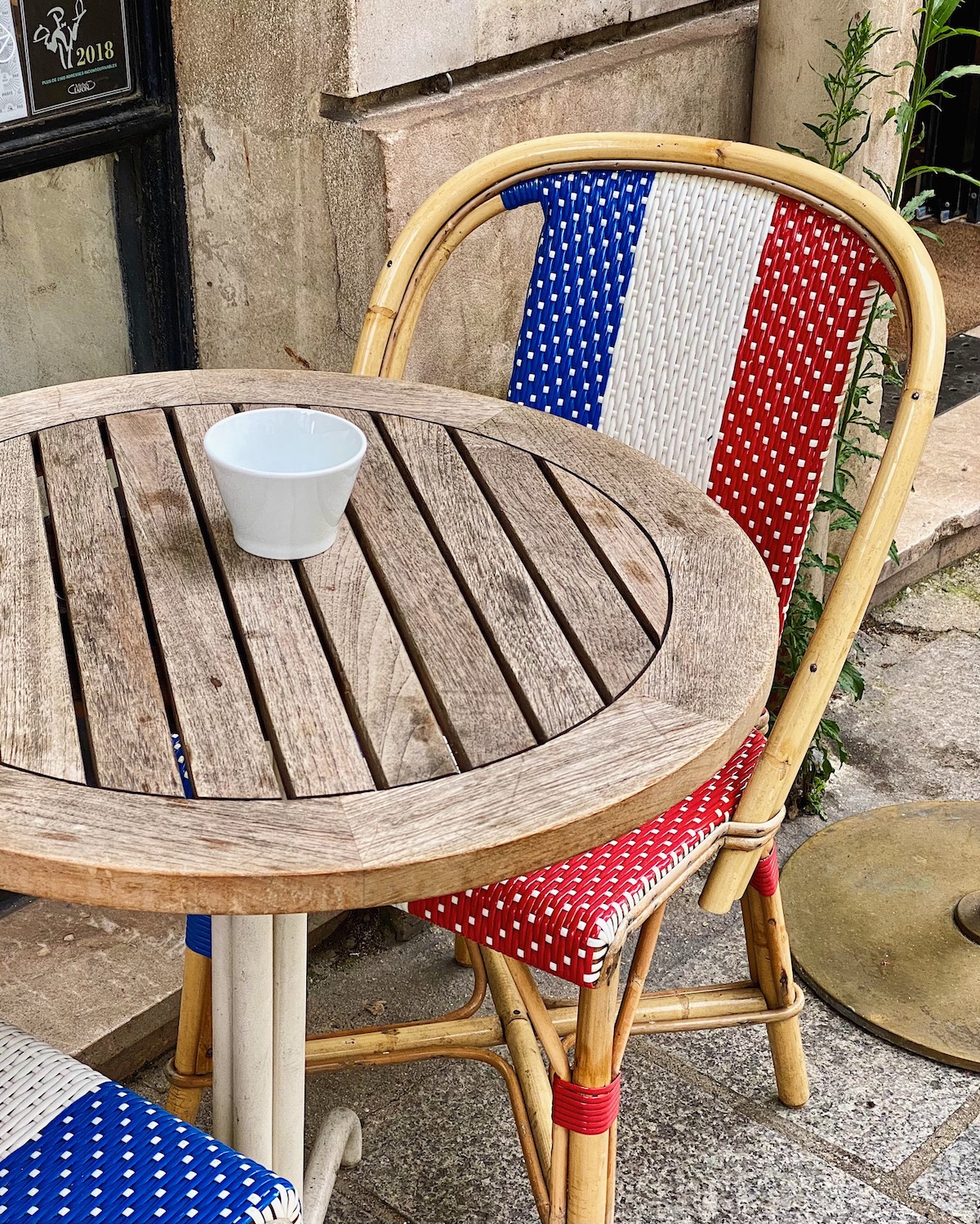 blue white and red cafe chair in paris